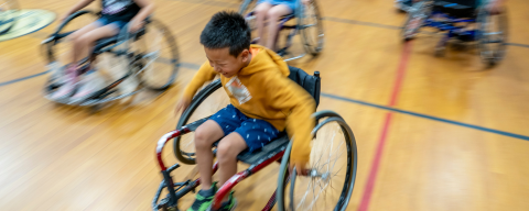 Elementary student enjoying wheelchair game