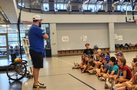campers having discussion with instructor